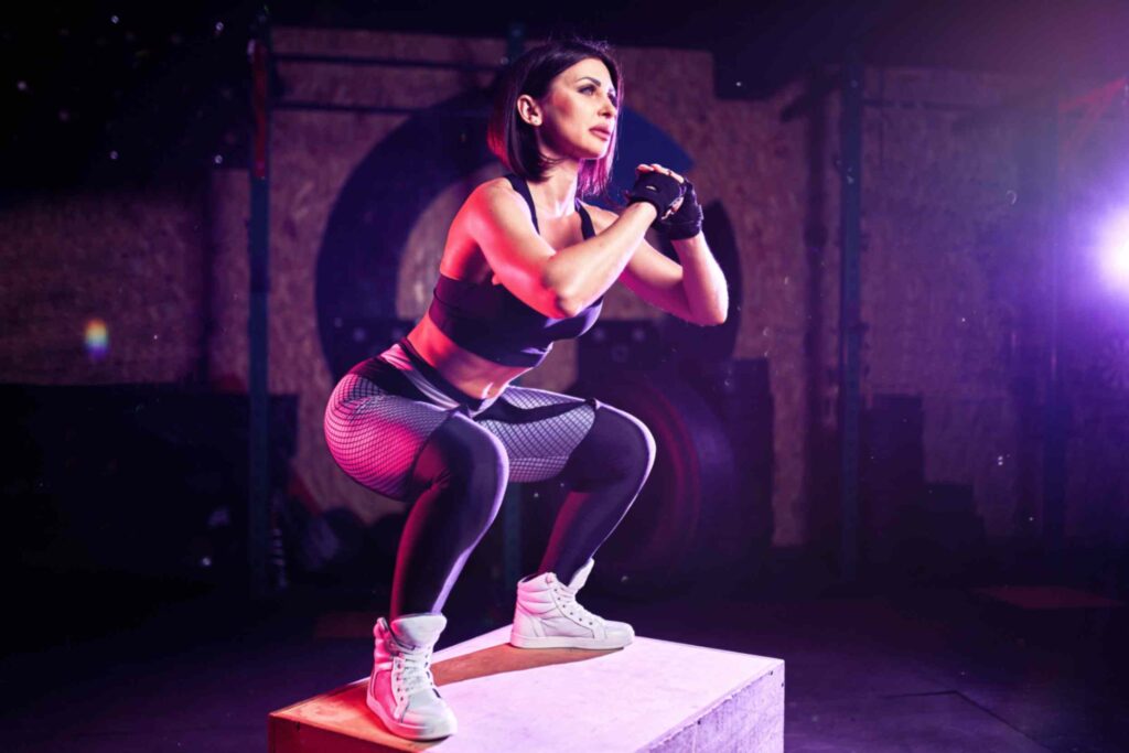 jpeg optimizer attractive fit middle age woman doing box jumping cross fit style female athlete is performing jumps gym - Fit Kilter